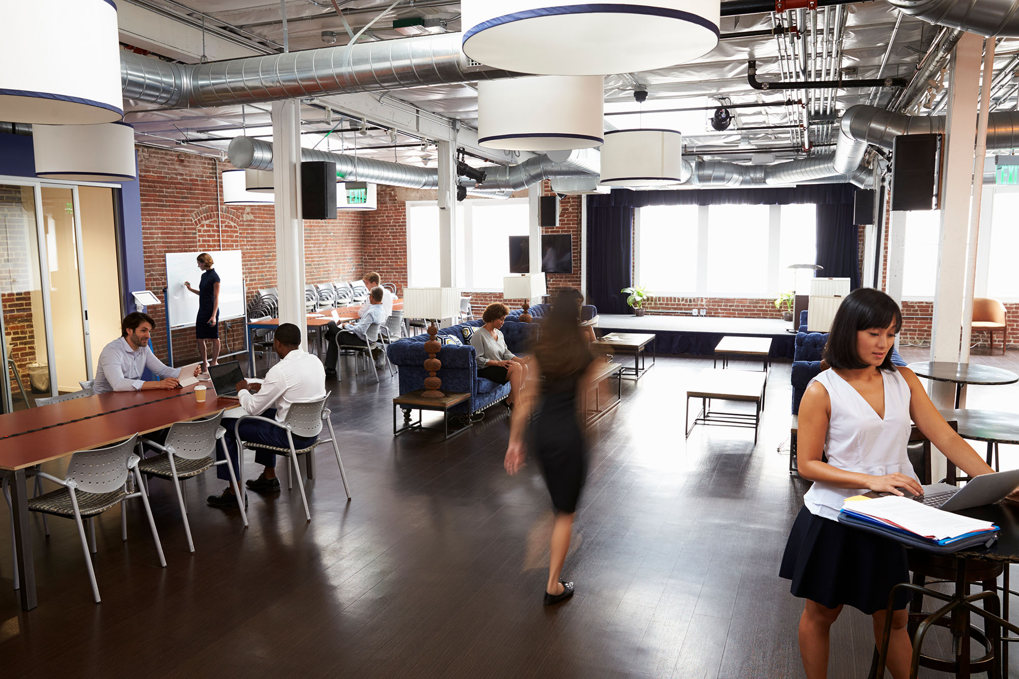 Interior Of Busy Design Office With Staff Interior Of Busy Design Office With Staff